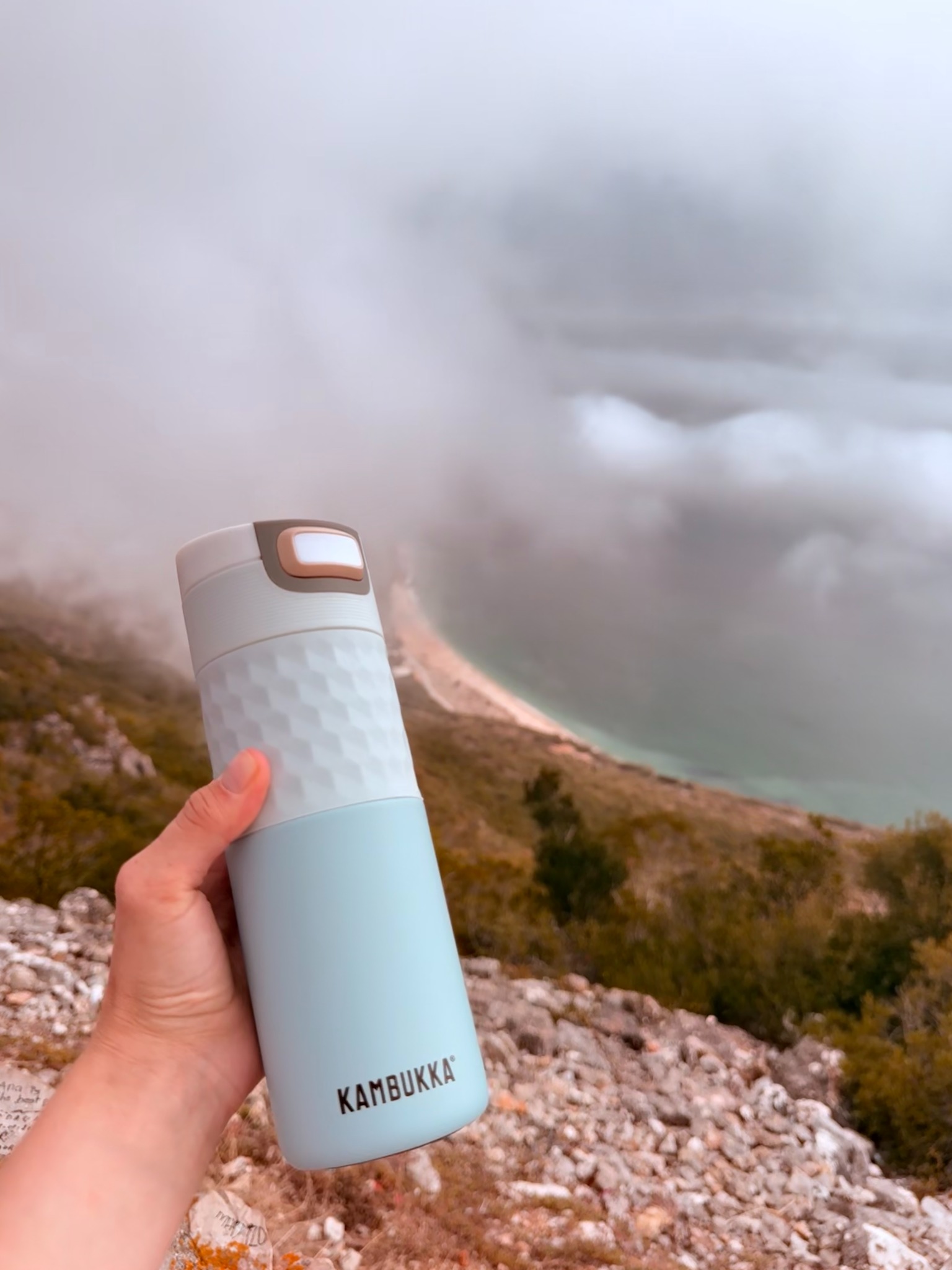 Kambukka travel mug overlooking the coast